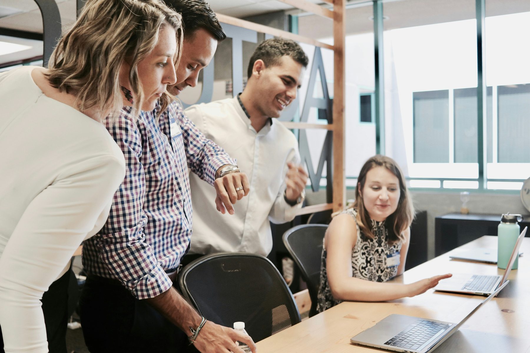 Colleagues reviewing information together during a workplace meeting
